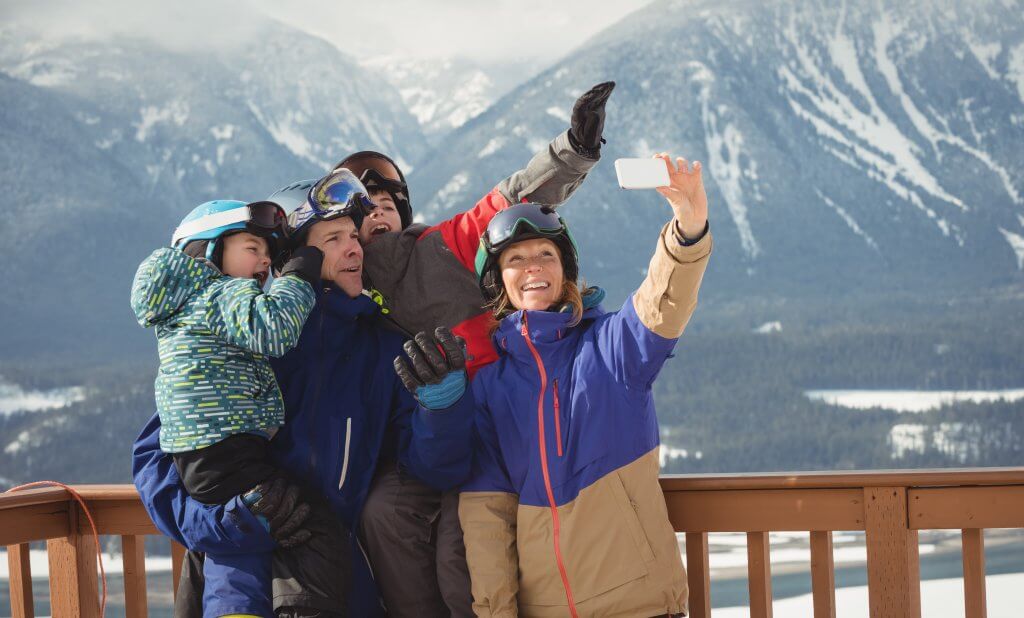 A happy family taking a selfie at the Vail, Colorado